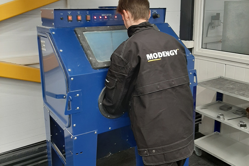 Microsandblasting the parts at the Modengy Engineering Center