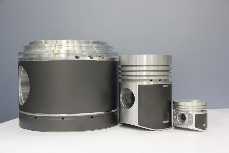 Pistons coated with MODENGY solid-film coatings